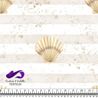 Seashell on a beige and white striped background with sand speckles