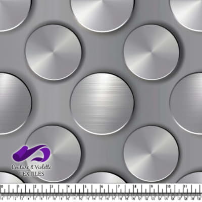 Metallic silver brushed steel circular discs on gray background