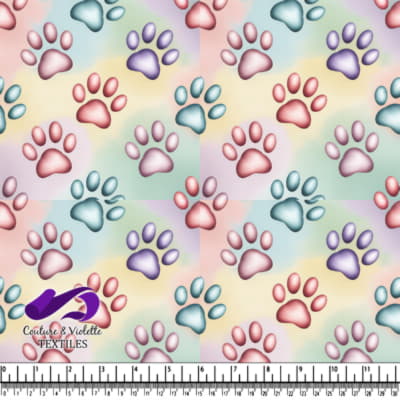 Colorful paw prints pattern on a soft pastel background