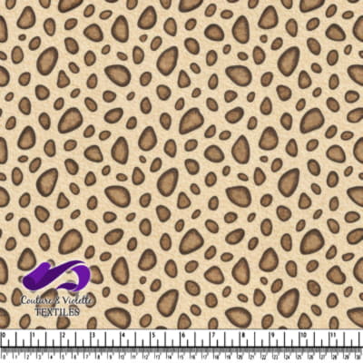 Leopard print fabric pattern with beige background and brown spots
