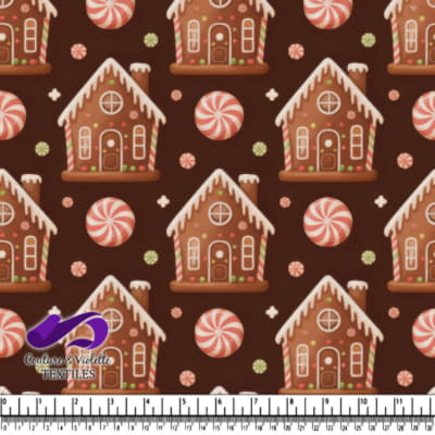 Gingerbread houses and peppermint candies on brown background