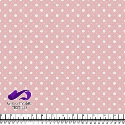 Pink fabric with white polka dots pattern