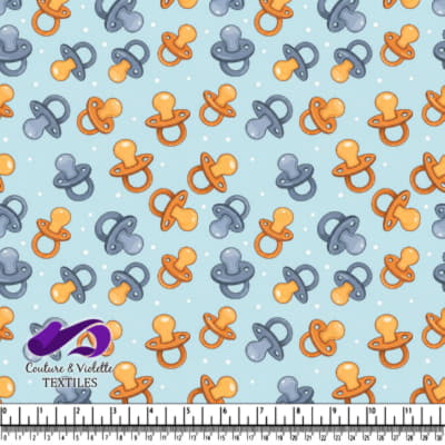 Motif de tétines de bébé sur fond bleu